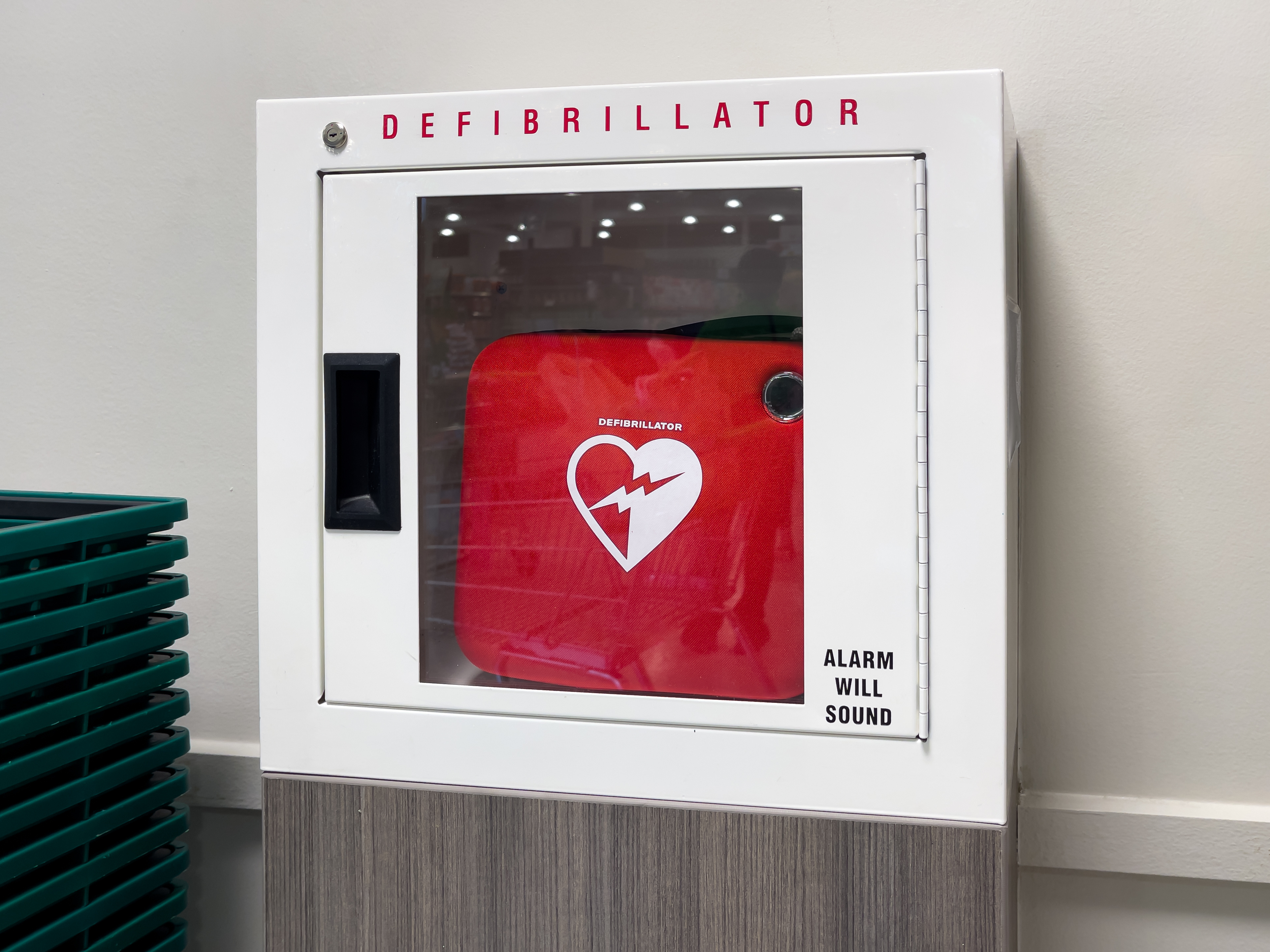 AED in a storage box on the wall in a building