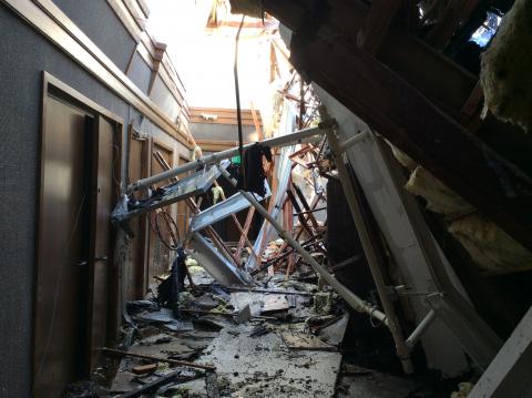 Interior of church showing damage from roof collapse