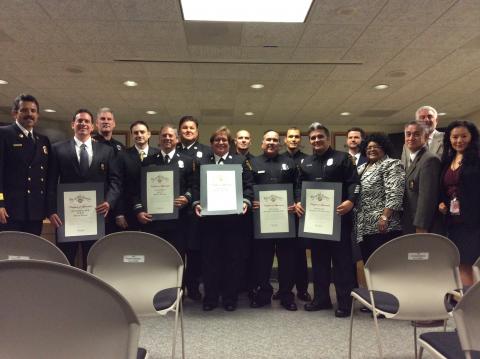 The Fire Commission Board poses for a photo with the honorees.