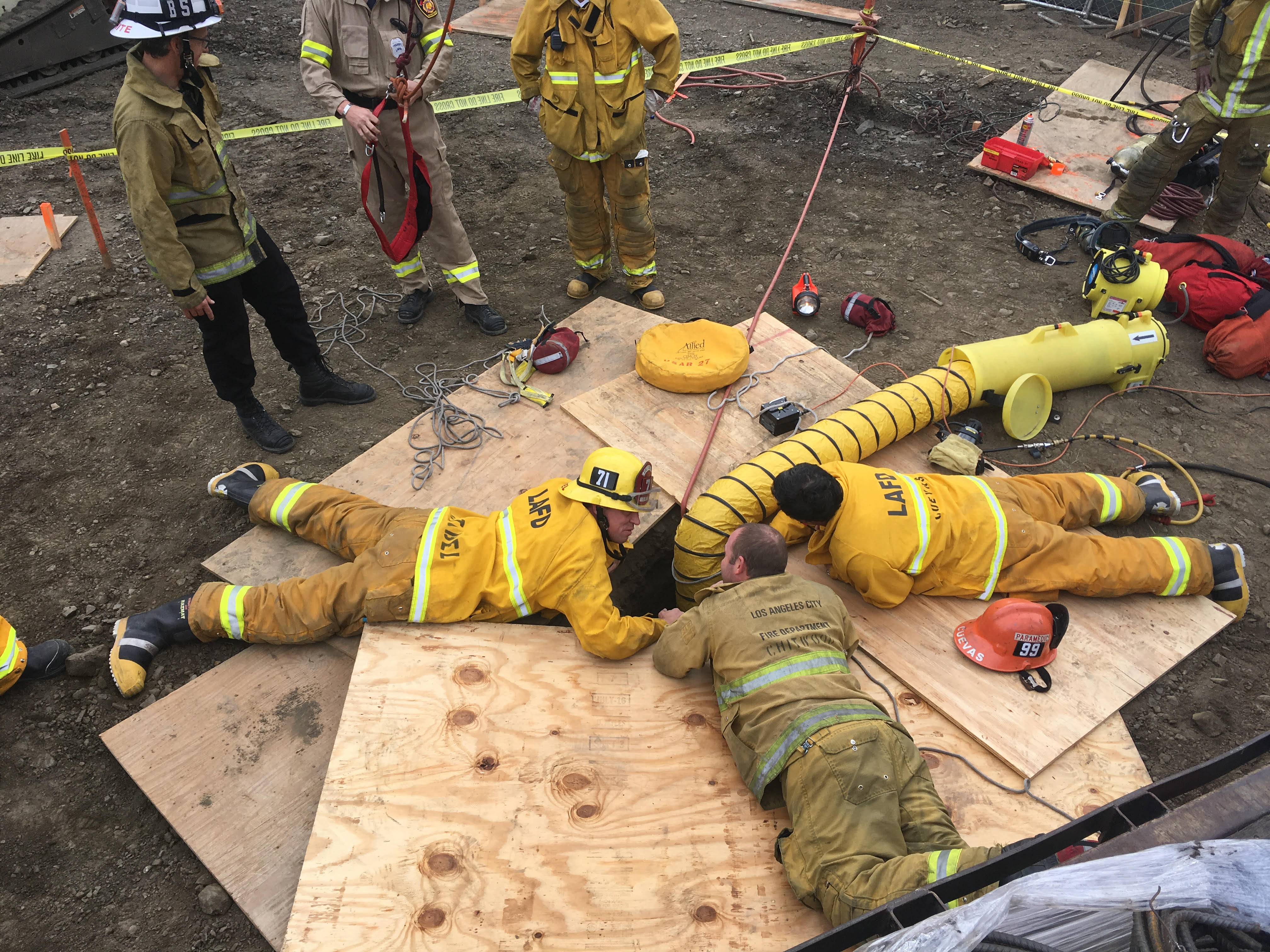 LAFD Firefighters Prepare to Rescue Man Trapped 50' Below Ground