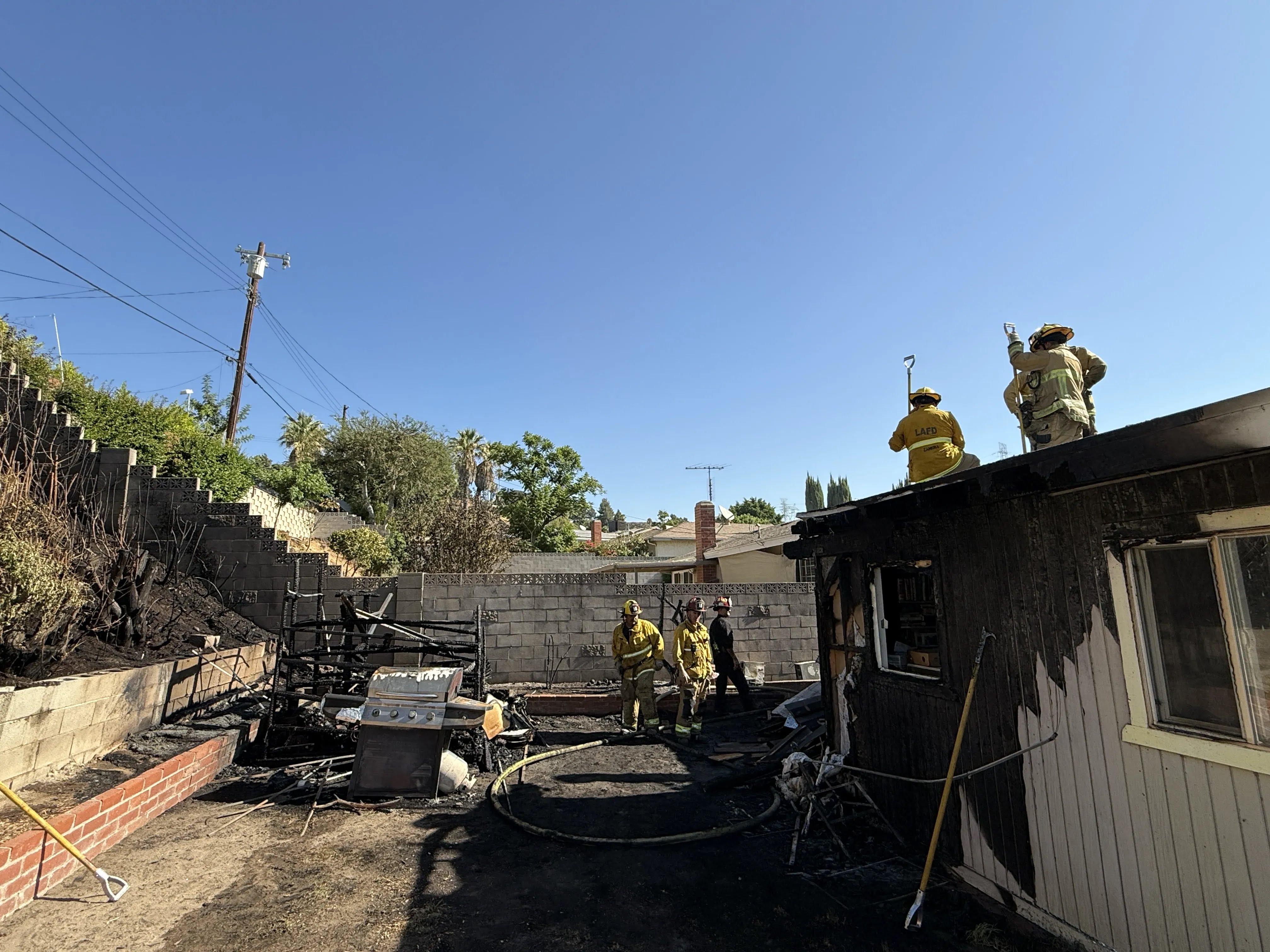 Back yard of structure fire.