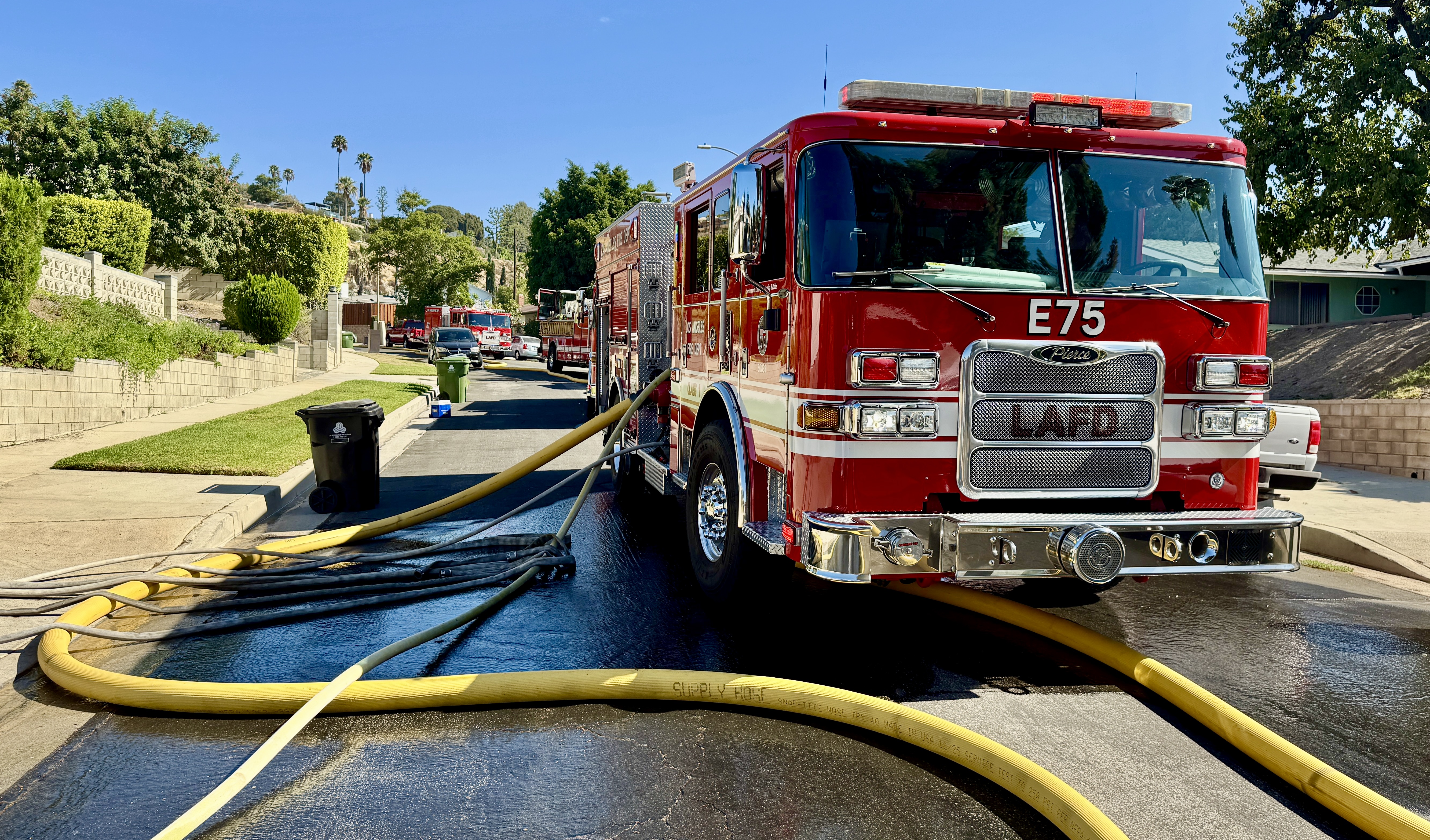 Fire engine with supply lines attached.