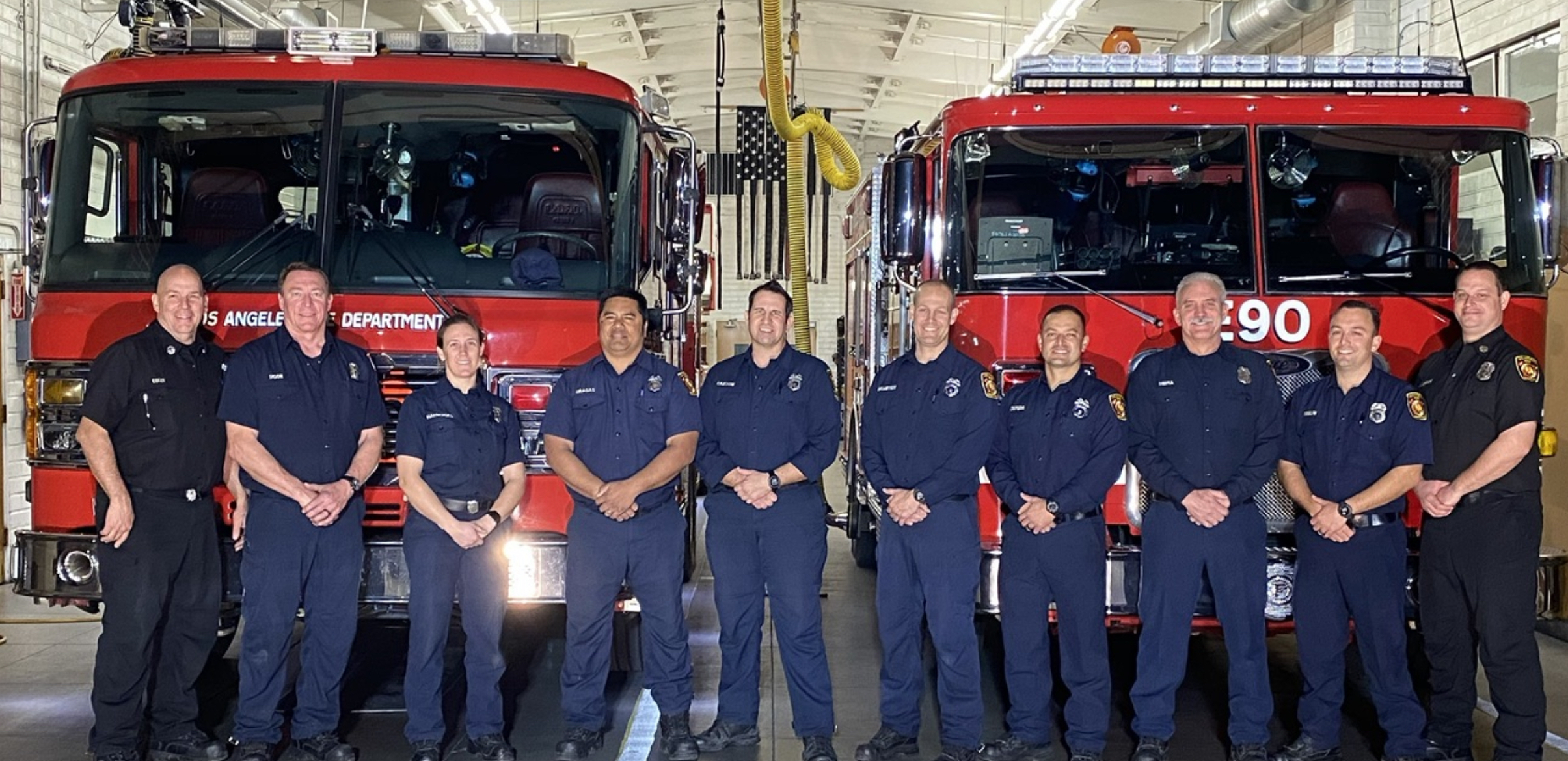 Station members standing with Captain Egizi