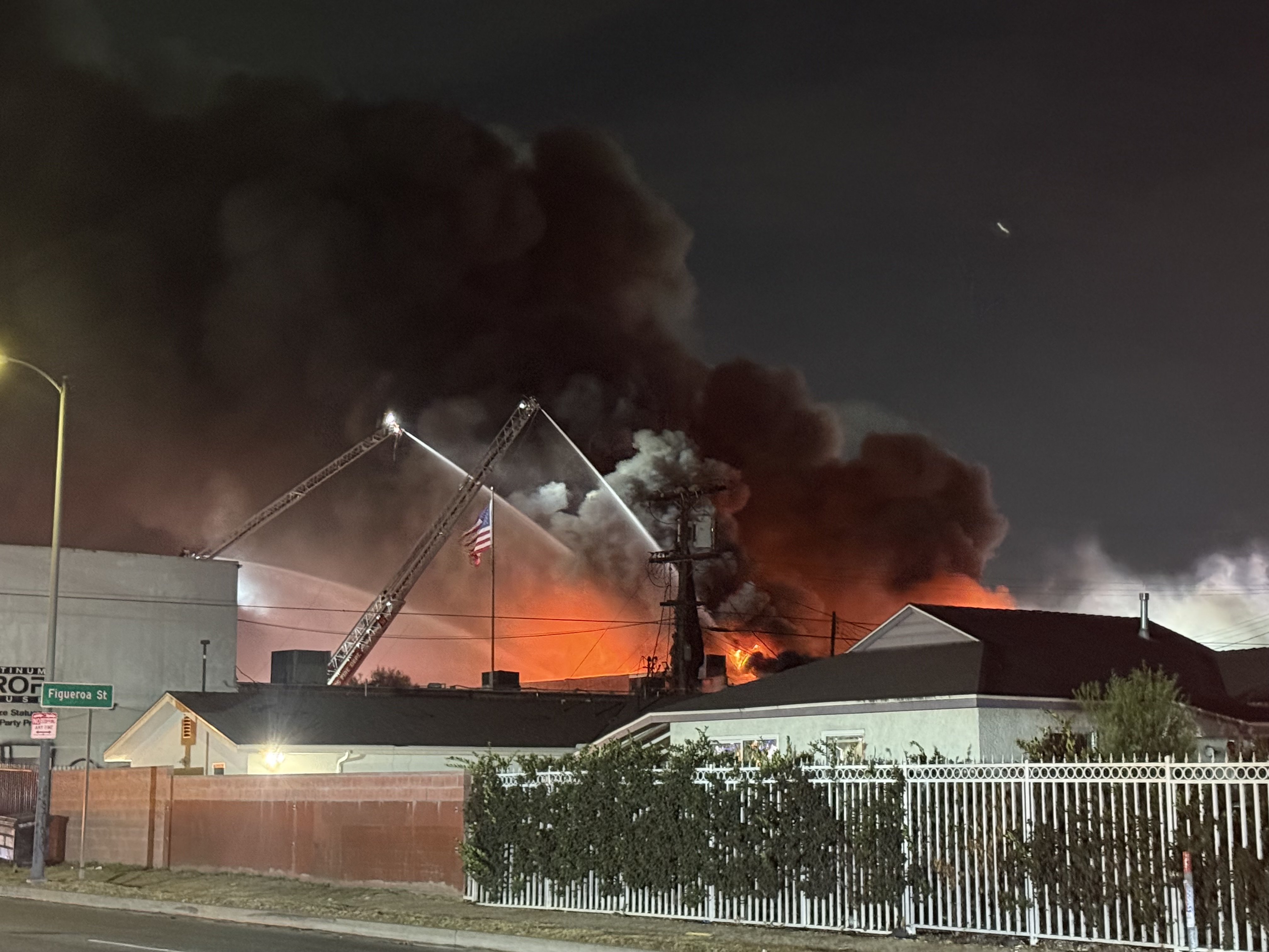 LAFD Ladder pipe operation at a commercial fire in Harbor Gateway on July 4 2026 at 9:49PM