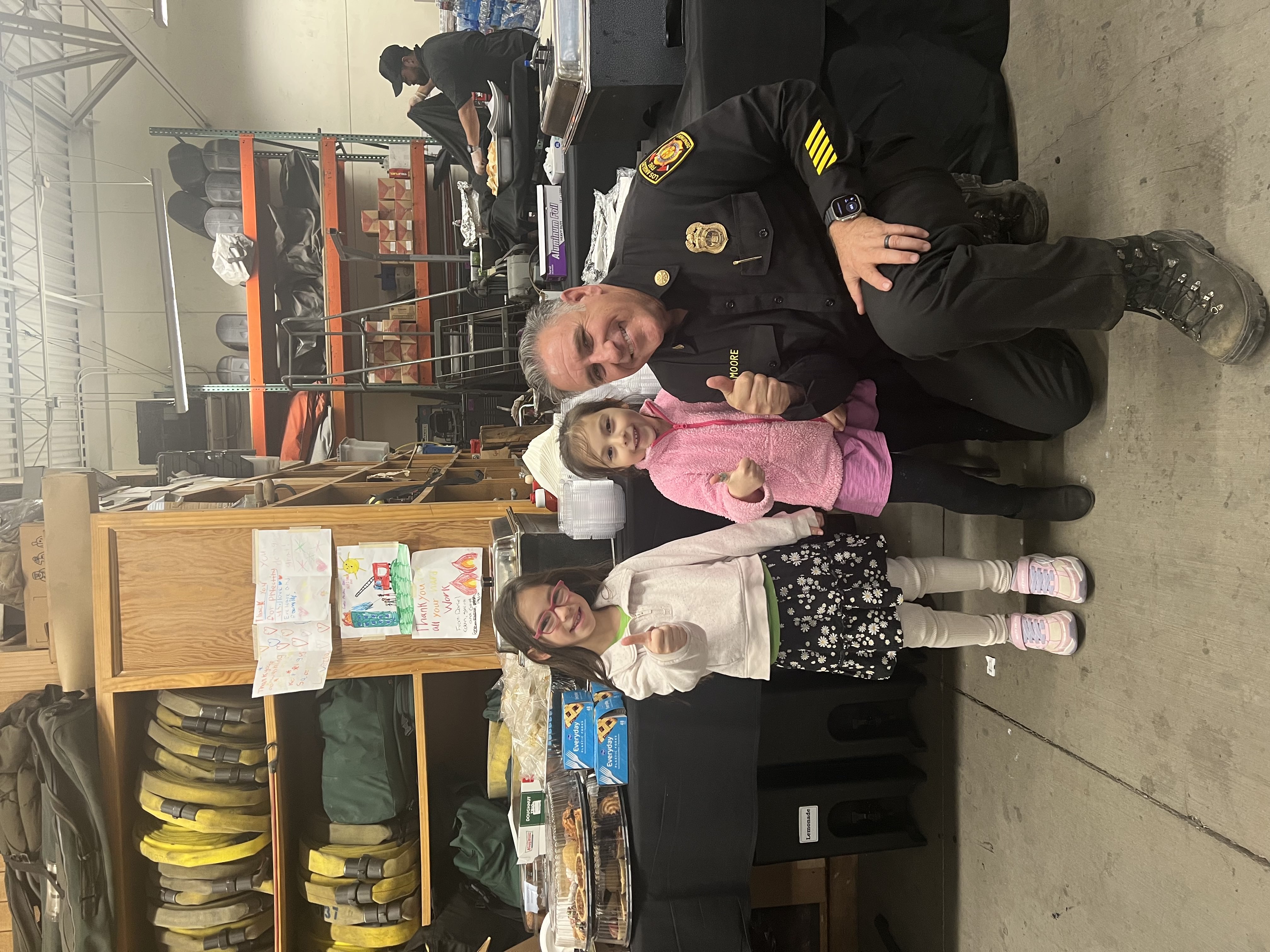 two young kids with a LAFD officer